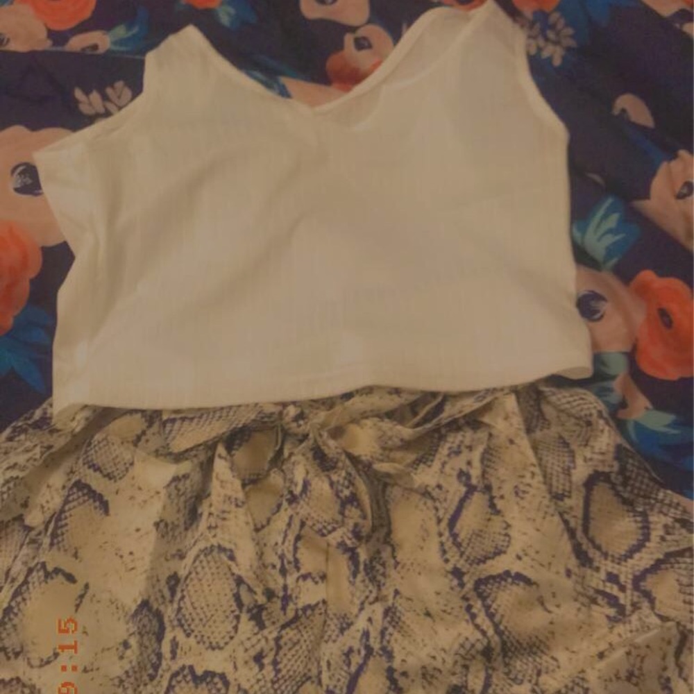 Ripped Tank Top And Snakeskin Shorts